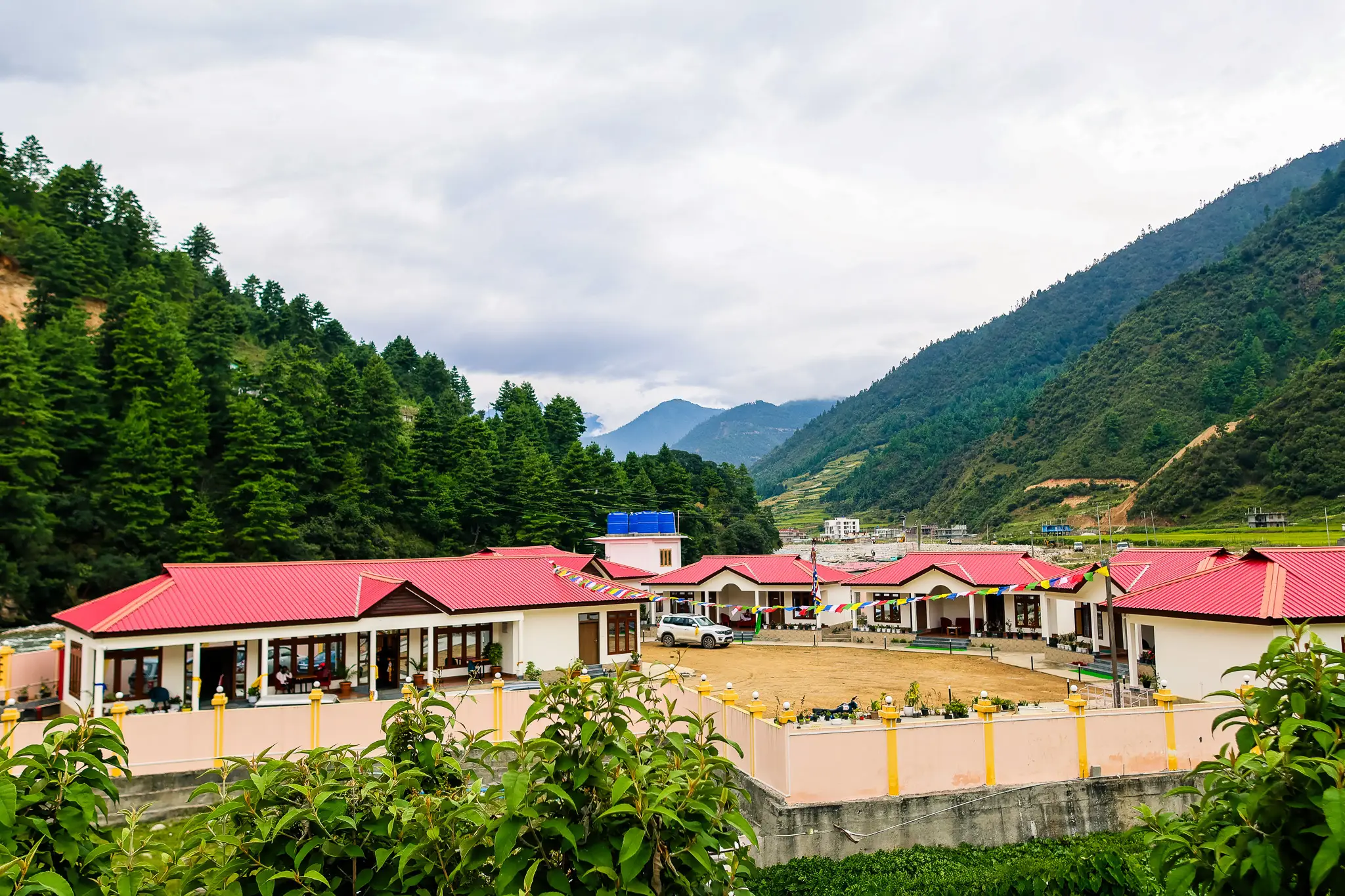 Rivero Resort Dirang panoramic view with red roofs and mountains
